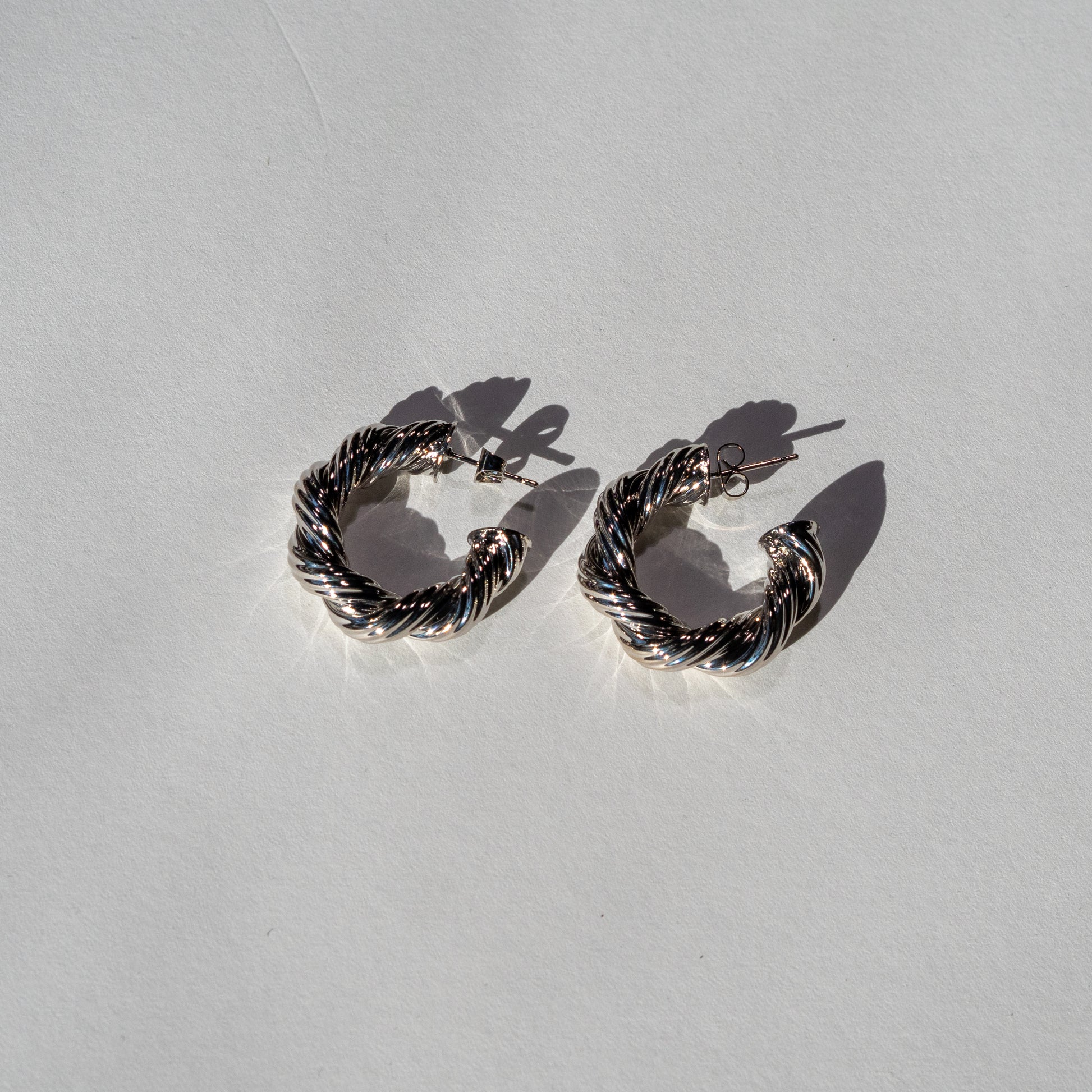 Twisted Silver Hoop Earrings Blaze and Sparkles
