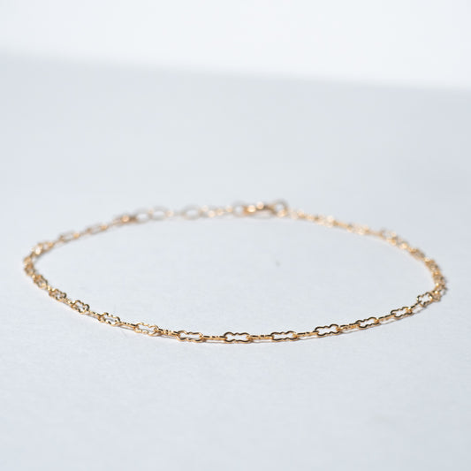 Dainty gold filled Crinkle chain bracelet on white background. 